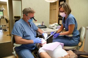Dr. Vandewater works on a patient's teeth at his dental practice in Ellisville, MO.