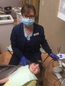 Dr. Vandewater's staff with a pediatric dental patient.