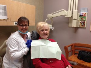 Dr. Jay Vandewater's dental hygienist with a happy patient.